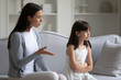 © fizkes - Young mom lecture sad little daughter at home
