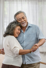Asian Couple Grandparent Dancing And Hugging Together With Happy Feeling In House, Romantic And Lover With Valentine Or Anniversary, Long Live And Elderly Society, Warm Family And Happiness Concept