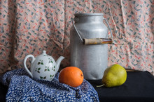 Still Life With A Milk Can, Teapot, Pear And Orange. Vintage Russian Painting Style
