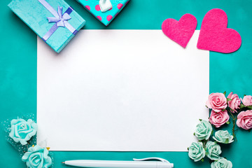 Wall Mural - greeting card with flowers and heart. background with copy space. selective focus. top view.