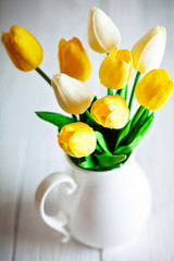 Wall Mural - bouquet of spring tulips on a bright background. greeting card.