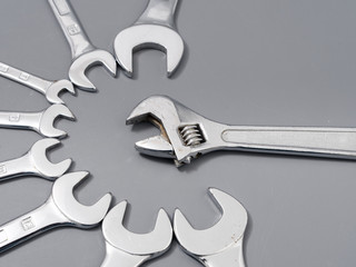 auto repair wrenches on a gray background