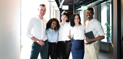 Wall Mural - Cheerful business workers at workplace