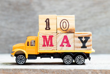 Truck Hold Letter Block In Word 10may On Wood Background (Concept For Date 10 Month May)