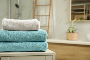 Wall Mural - Stack of clean towels on table indoors. Space for text