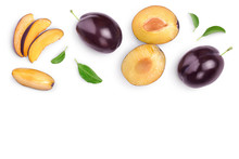 Fresh Purple Plum And Half With Leaves Isolated On White Background With Clipping Path And Copy Spase For Your Text. Top View. Flat Lay