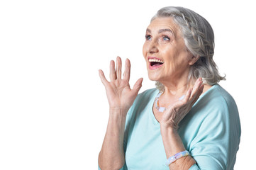 Wall Mural - Beautiful senior woman, posing against white background