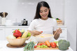 © Pormezz - Eat healthy food for good wellness health concept. Woman cooking salad menu with fresh organic vegetables