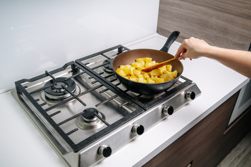 Cooking fried potatoes. Frying potatoes on the frying pan