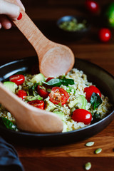 Wall Mural - Healthy salad with bulgur, avocado, spinach and cherry tomatoes.