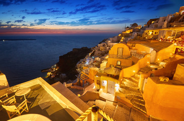 Fira town on Santorini island, Greece. Incredibly romantic sunset on Santorini. Oia village in the morning light. Amazing evening view with white houses. Island lovers