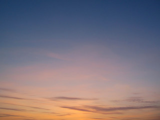 Wall Mural - clear sky with small clouds on the horizon at sunset. beautiful colorful sky at sunset background.