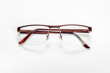 The male medical half-rim eyeglasses with folded temples on a white background