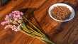 sideview. Flowers laid on the table with coffee beans.