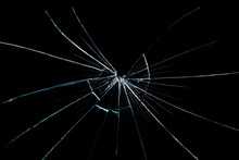 Crack On The Broken Glass Mirror On A Black Background Chipped