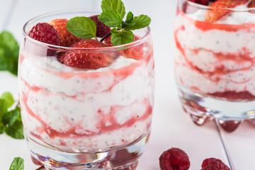 Wall Mural - Chia pudding with strawberry sauce and berries.