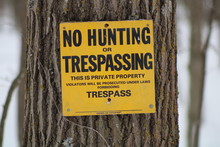 No Trespassing Sign Posted For Rural Wooded Property, Winter, Snow