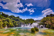 Beautiful Skradinski Buk Waterfall In Krka National Park - Dalmatia Croatia, Europe. Beautiful long exposure panorama of waterfalls (milk effect). A true natural wonder. Amaizing sunlight view.
