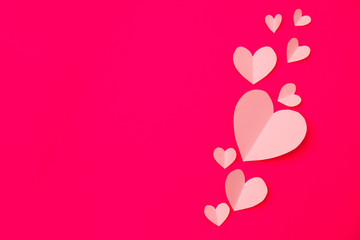 Wall Mural - Shape of heart flying on pink paper background.