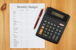 © Karen Roach - Creating your monthly budget with a calculator and pen