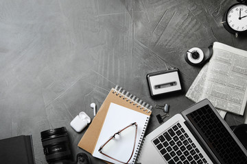 Wall Mural - Flat lay composition with equipment for journalist on grey table, space for text