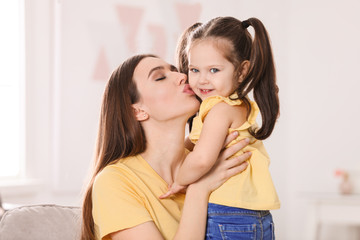 Poster - Young mother with little daughter at home