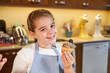 © PHILIPPE DEGROOTE/ADDICTIVE STOCK - Stock photo of a girl with a cupcake in her hand and nose dirty with cream