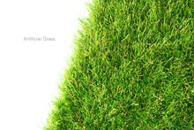 Green Artificial Grass On A White Background, Copy Space.