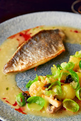 Wall Mural - Grilled sea bass fillet with vegetable garnish