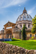 Rome, Vatican, Italy - Panoramic view of St. Peter’s Basilica main dome by Michelangelo Buonarotti with the Fountain of the Sacrament seen from the Vatican Gardens in the Vatican City State