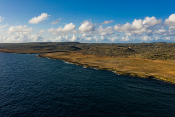 Wall Mural - Aerial view of coast of Curaçao in the Caribbean Sea with turquoise water, cliff, beach and beautiful coral reef around Boka Ascension