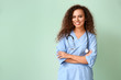 Young African-American nurse on color background