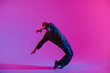 © Сергей Уланов - Young Man in a Jumper Dancing Contemporary Dance in Studio. Breakdancing. Dance School Poster. Copy Space. Battle competition announcement. Pink and Blue Background.