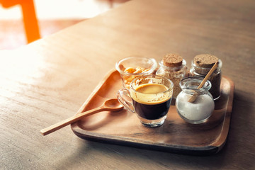 Wall Mural - Espresso coffee and cracker on wooden table background