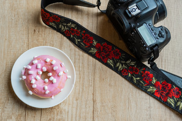 pink donuts with a reflex camera