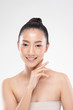© 220 Selfmade studio - Beautiful Asian young woman touching soft cheek smile with clean and fresh skin Happiness and cheerful with positive emotional,isolated on white background,Beauty and Cosmetics Concept
