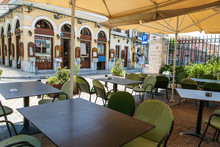 A Greek Athens Cafe Terrace Covered With Parasols.