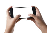 Fototapeta  - Two hands holding smart phone with blank screen in horizontal orientation and playing video games