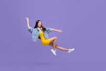 Young Beautiful Smiling Asian Girl Floating In Mid-air