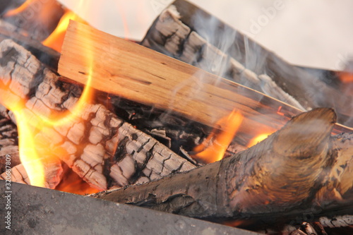 log in the flames. burning fire in the grill is large. Poster Mural XXL
