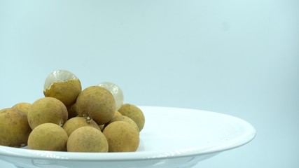 Longan fruit with a white plate In white background. 