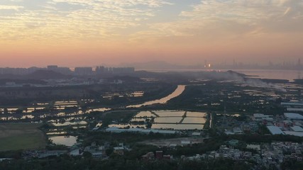 Wall Mural - Aerial View of rural green fields in Hong Kong border and skylines in Shenzhen, China