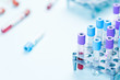 © bymandesigns - Tube vials with blood sample and medical samples in rake, medical analysis laboratory