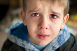 Fototapeta Na drzwi - Sad child who is crying