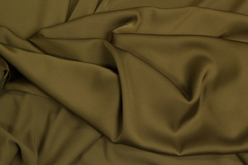 Fabric satin silk drapery. Green textile