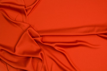Fabric satin silk drapery. Red textile