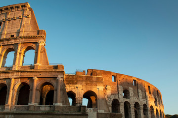 Colosseum at sunset in Rome, Italy. Ancient Roman Colosseum is one of the main tourist attractions in Europe. View of Colosseum in Rome during sunset.