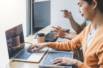 Wall Mural - two professional programmer cooperating and working on web site project in a software developing on 