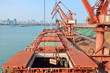 © masterskuz55 - Type of cargo terminal and cranes, berths for transshipment of bulk cargo iron ore. Port Rizhao, China.