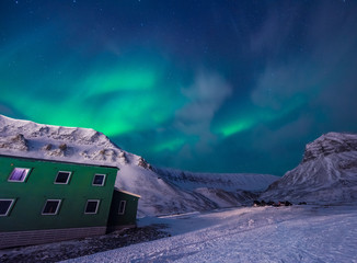 the polar arctic northern lights aurora borealis sky star in norway svalbard in longyearbyen with th